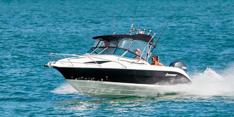Two men on a speedboat.&nbsp;