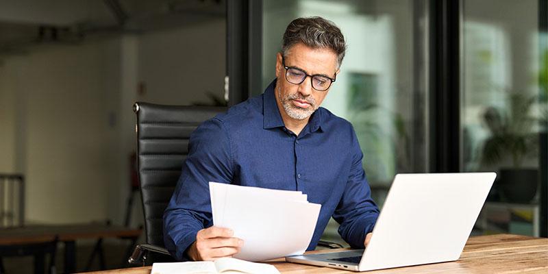 Man looking over documents.