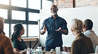 Businessman speaking to colleagues
